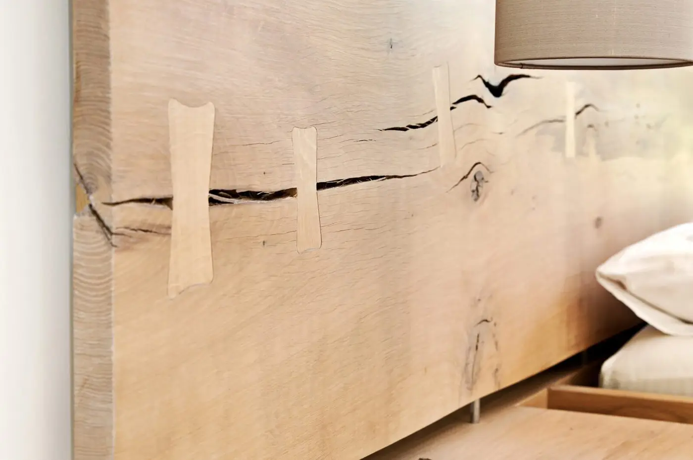 Crafted oak headboard to the master bed