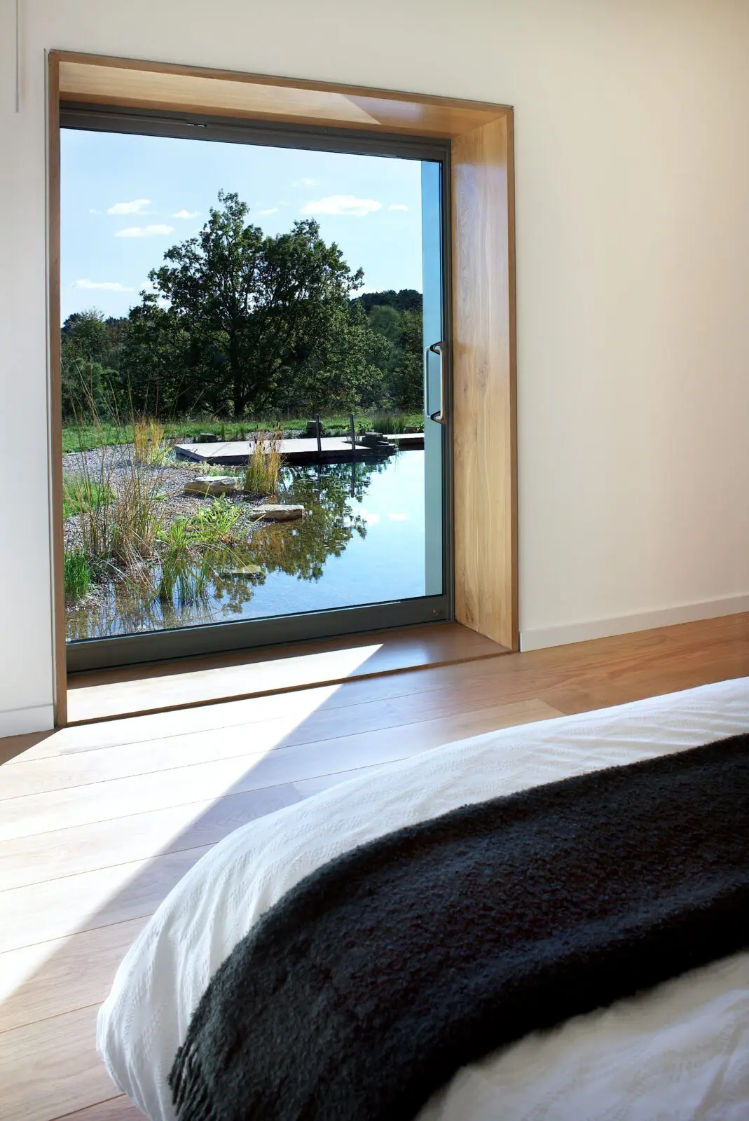 Inside the crafted rural retreat with a view over the natural pool